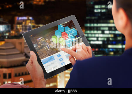 Composite 3d image of businesswoman working on digital tablet over white background Stock Photo