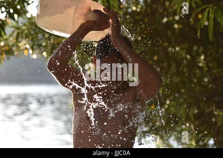 Hefei, China's Anhui Province. 20th July, 2017. A swimmer takes a simple shower after swimming at the Huancheng Park in Hefei, capital of east China's Anhui Province, July 20, 2017. Credit: Yang Xiaoyuan/Xinhua/Alamy Live News Stock Photo