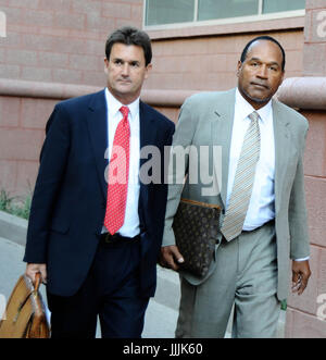 July 20, 2017: FILE PHOTO: A Nevada parole board has granted O.J. SIMPSON parole after the former NFL star apologized, said he was a model prisoner, and promised that he'd have no conflicts if released. Simpson has served nine years of a nine-to-33-year sentence for an armed robbery and kidnapping in Las Vegas in 2007. He is expected to be released as early as October. Pictured: Sep 15, 2008 - Las Vegas, Nevada, USA - OJ SIMPSON with his lawyer ROBERT LUCHERINI leave the Clark County Regional Justice Center after the first day of opening statements of his robbery-kidnapping trial (Credit Image Stock Photo