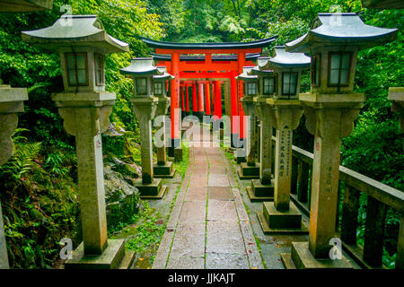 KYOTO, JAPAN - JULY 05, 2017: Torii gates of Fushimi Inari Taisha shrine in Kyoto, Japan. There are more than 10,000 torii gates at Fushimi Inari. Stock Photo