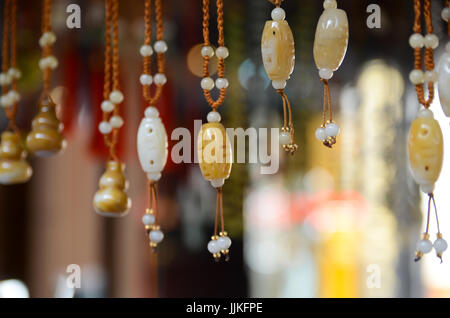 Vendor in China selling chinese trinkets Stock Photo