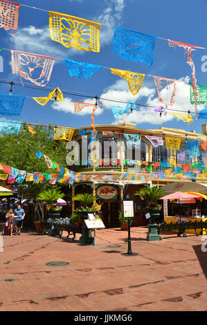 Papel Picado banners fly overhead at El Mercado in San Antonio Texas Stock Photo