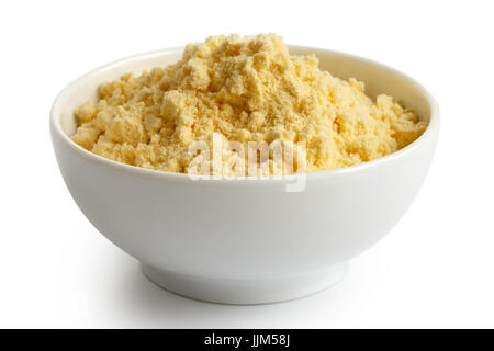 Corn flour  in white ceramic bowl isolated on white. Stock Photo