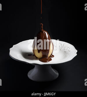 Pear Poached with Chocolate sauce Stock Photo