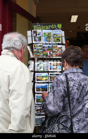 Couple buying holiday postcards in Ireland Stock Photo
