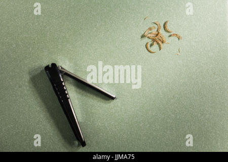 close up of nail clippers and Nails are cut. Stock Photo