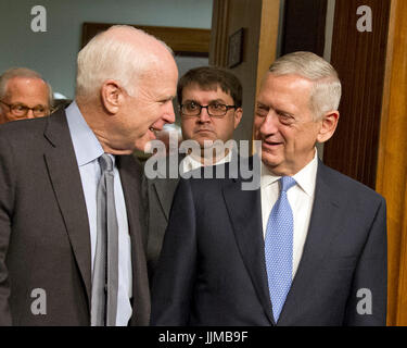 United States Senator John McCain (Republican of Arizona), Chairman, US Senate Committee on Armed Services, left, escorts US Marine Corps General James N. Mattis (retired), right, into the room as committee holds a confirmation hearing on Mattis' nomination to be Secretary of Defense on Capitol Hill in Washington, DC on Thursday, January 12, 2017. Credit: Ron Sachs / CNP /MediaPunch Stock Photo