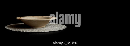 empty dish on black background with shadow Stock Photo