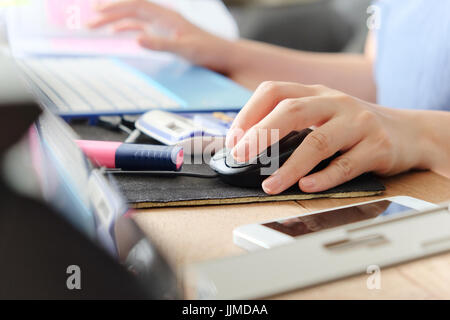 woman hand using a computer mouse, working time Stock Photo