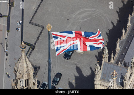A close up aerial view of the Union Flag flying from the Houses of Parliament Stock Photo