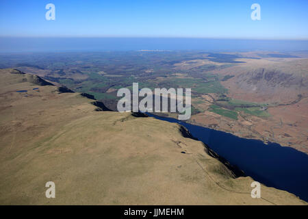 An aerial view looking along the Wastwater Screes with Wastwater and the Lake District beyond visible in the distance Stock Photo