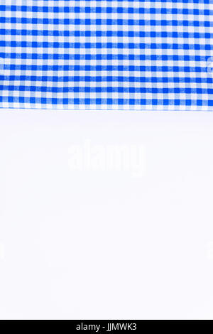 Blue cloth, a kitchen towel with a checkered pattern, on a white background isolated. Stock Photo