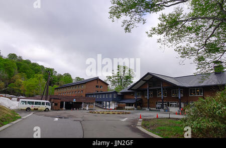 Tohoku, Japan - May 17, 2017. Wooden hotel at Tamagawa Hot Spring in Tohoku, Japan. Tamagawa is located in a valley about 12 km west of the peak of Ha Stock Photo