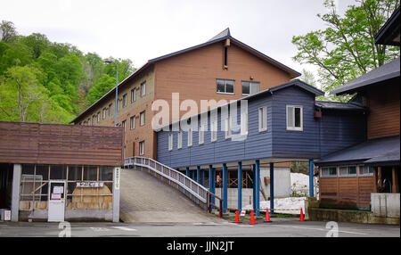 Tohoku, Japan - May 17, 2017. Wooden cottage at Tamagawa Hot Spring in Tohoku, Japan. Tamagawa is located in a valley about 12 km west of the peak of  Stock Photo