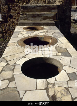 Italy. Pompeii. Marble covered counter Thermopolium. Via Consolare. Stock Photo
