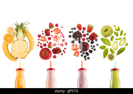 different healthy smoothies in bottles with fresh ingredients isolated on white, fresh fruit smoothie concept Stock Photo