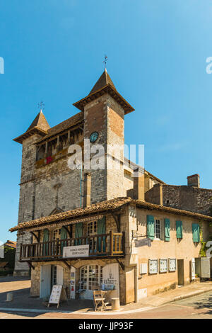 Estate agency & the medieval (1264) Church of Notre Dame in this south western historic bastide town. Villereal; Lot-et-Garonne; France Stock Photo