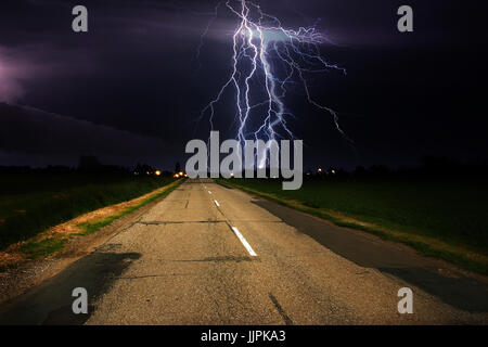 Stormy clouds over asphalt road Stock Photo - Alamy