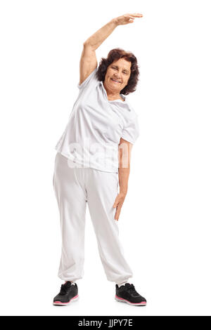 Full length portrait of an elderly woman exercising isolated on white background Stock Photo