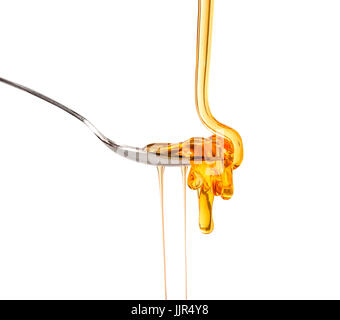Honey Pouring Waves Isolated on Seamless White Background Stock Photo