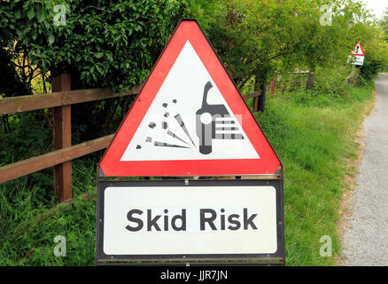 Skid Risk, motorist, warning sign, England, UK, English roadside, warnings, signs Stock Photo