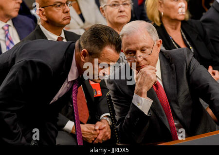 US. Attorney General Jeff Sessions talks with one of his aids prior the start of his testimony  in front of the Senate Intelligence Committee. Washington DC, June 13, 2017. ( Stock Photo