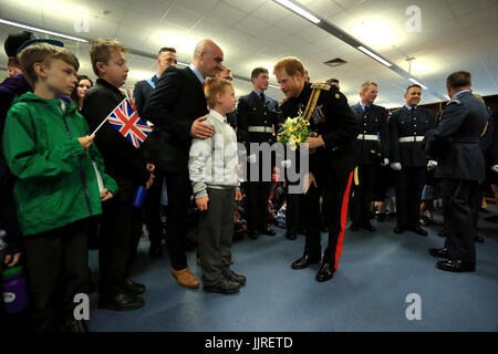Prince Harry meets Jordan Brown and his son Sam during an official visit to RAF Honington in Bury St Edmunds.