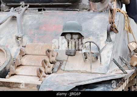 German WW2 gas mask and helmet mounted on the front of an American Sherman tank. Stock Photo
