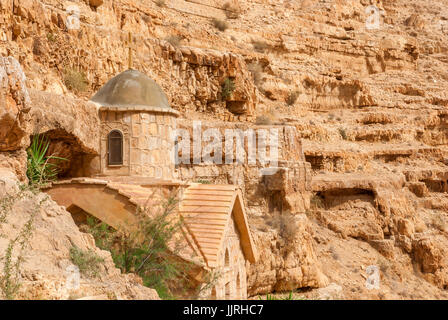 St. George Orthodox Monastery is located in Wadi Qelt. The sixth-century cliff-hanging complex, with its ancient chapel and gardens, is still inhabite Stock Photo