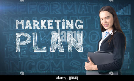 Beauty businesswoman on painted background with marketing words. Advertising, investment and business plan concept Stock Photo