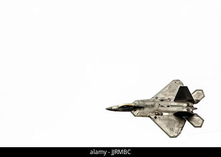 Top view of a F-22 in flight with white background. Stock Photo