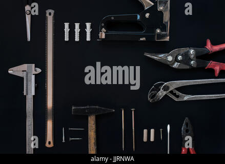 Working tools on black background. Top view. Copy space Stock Photo