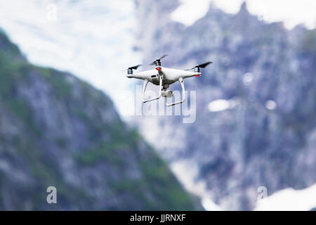 Drone quadcopter Dji Phantom 4 Pro with 4K digital camera while flying over the Folgefonna National Park, Norway Stock Photo
