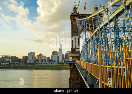 John A. Roebling Suspension Bridge with sunset and clouds at Cincinnati, Ohio. Stock Photo