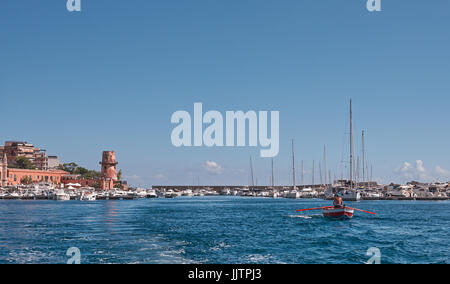 Palermo, Sicily, Italy, July 15 / 2017 Boats moored in the harbor, fisherman on the right - mediterranean sea Stock Photo