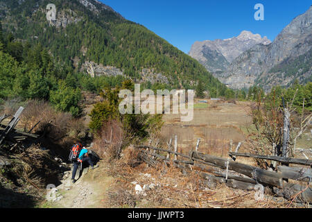 Lone trekker taking a break on the Annapurna Circuit near Thanchok, Nepal. Stock Photo