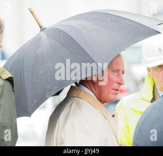 Newquay, UK. 21st July, 2017. Royal couple Duke and Duchess of Cornwall rained upon visiting the royal duchy`s housing development with hasty indoor picnic at the local fire station, Tregunnel Hill, Newquay, Cornwall, UK. 21st July, 2017. Credit: Robert Taylor/Alamy Live News Stock Photo