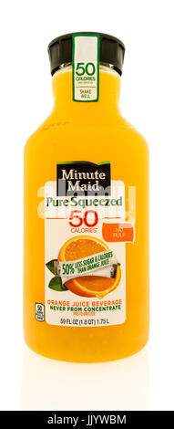 Winneconne, WI - 20 July 2017: A bottle of Minute Maid pure squeezed 50 calories orange juice on an isolated background. Stock Photo