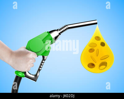 hand holding gas pump nozzle with oil drop and gold coins on blue background Stock Photo