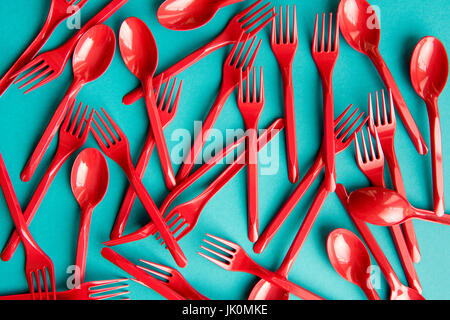 top view of set of plastic forks and spoons isolated on blue Stock Photo