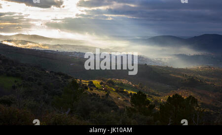 Overview of the Guadalupe town during a foggy sunrise, Caceres, Spain Stock Photo