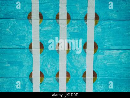 Hand painted circles and stripes on blue wood panel background Stock Photo