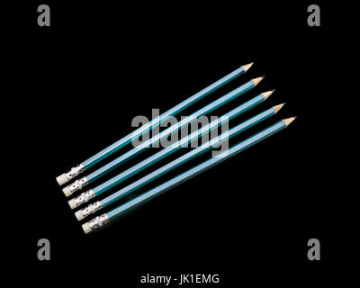 Five Pencils metalic blue and diagonaly positioned on a black background. Stock Photo