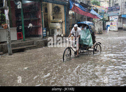 Rickshaw in the monsoon, Dhaka, Bangladesh Stock Photo