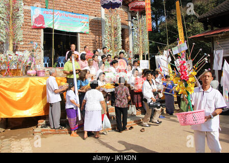 CHIANGMAI, THAILAND -OCTOBER 26 2014 : People in  Kathina ceremony in Paduaek temple, Saraphi district. Chiangmai, Thailand. Stock Photo