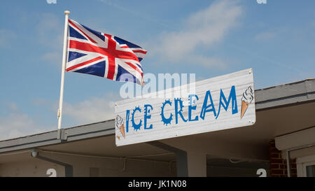 British Union flag (Union Jack) next to Ice Cream sign on the seafront promenade at Littlehampton in West Sussex, England Stock Photo