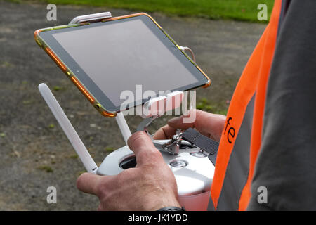 Licensed Drone Operator using Remote Control in the UK Stock Photo