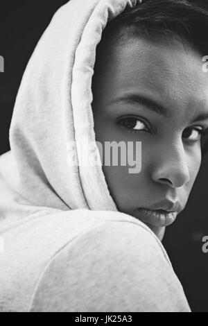 Close-up portrait of attractive young african american sportswoman looking at camera, black and white photo Stock Photo