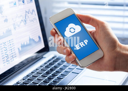 ERP (Enterprise Resource Planning) app on smartphone screen connecting data with cloud computing, access to HR management, production control, account Stock Photo