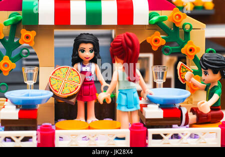 Tambov, Russian Federation - June 22, 2017 Lego Pizzeria. Waitress serves pizza for guests in restaurant. Studio shot. Stock Photo